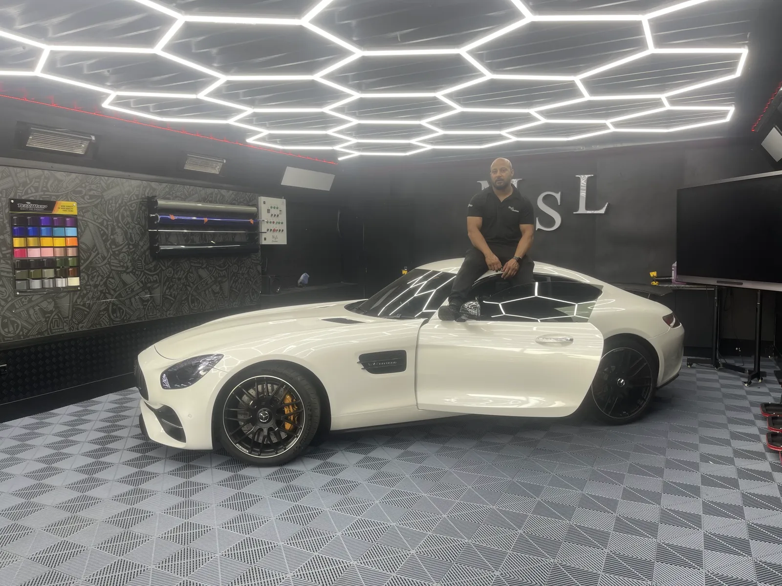 A standard white Mercedes-AMG GT in the MSL Customs workshop before work began