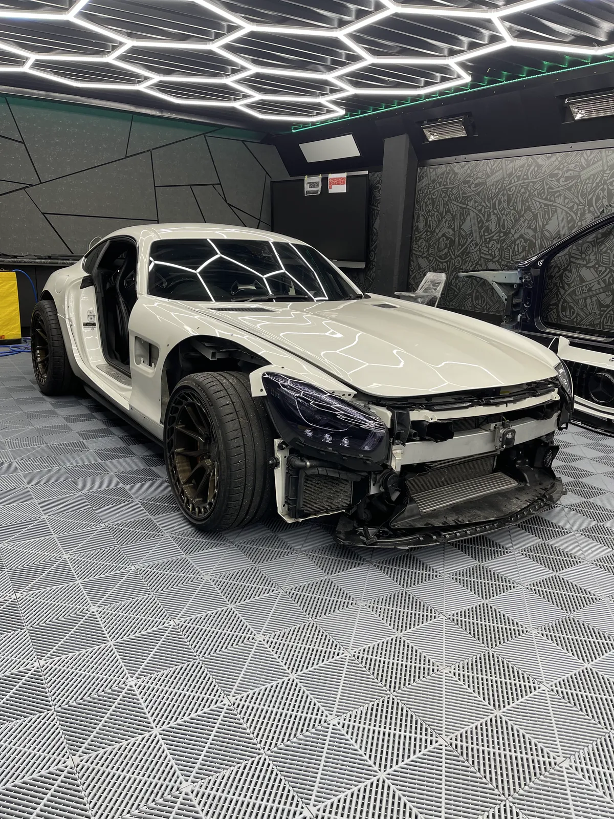 The AMG GT with its front bumper removed and arches fitted