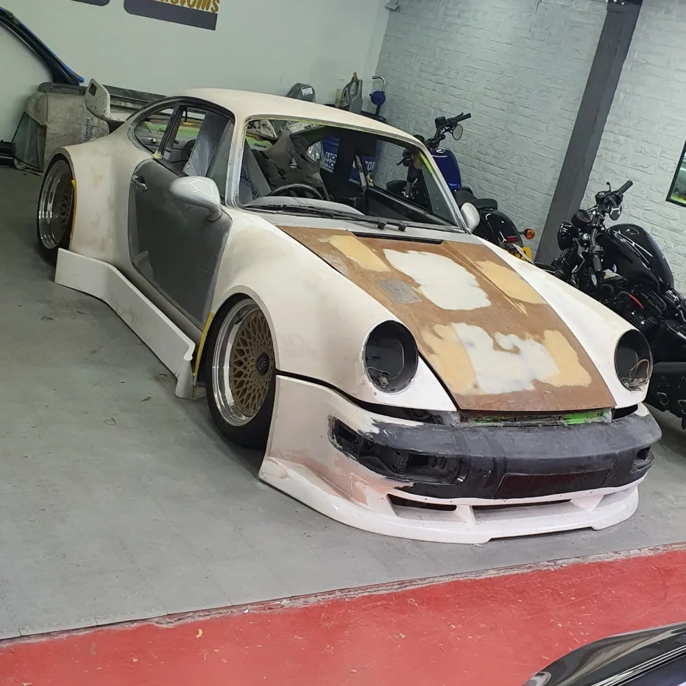Widebody Porsche 911 in primer during the build at MSL Customs